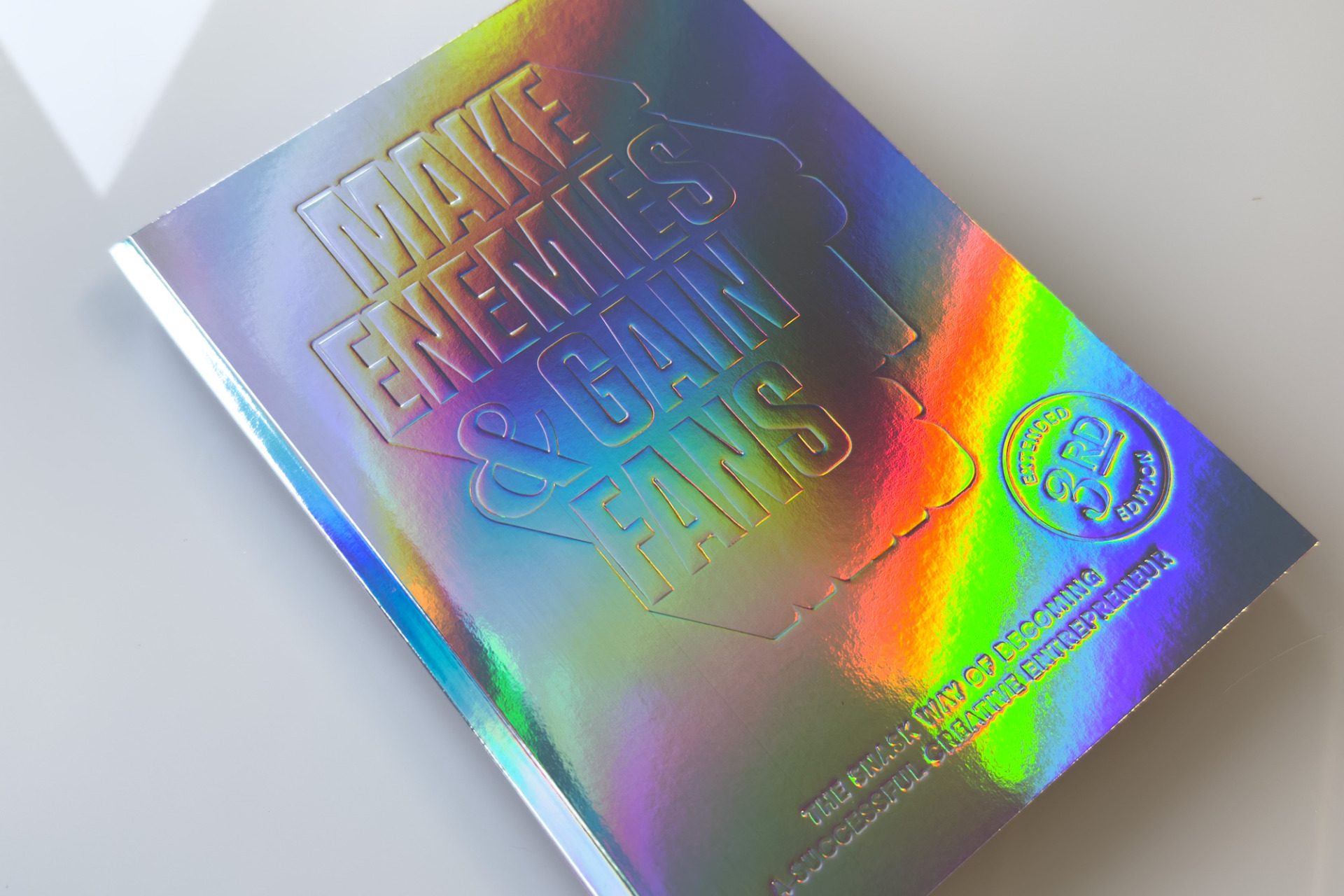 Image of Make Enemies & Gain Fans 3rd and Final edition in holographic cover